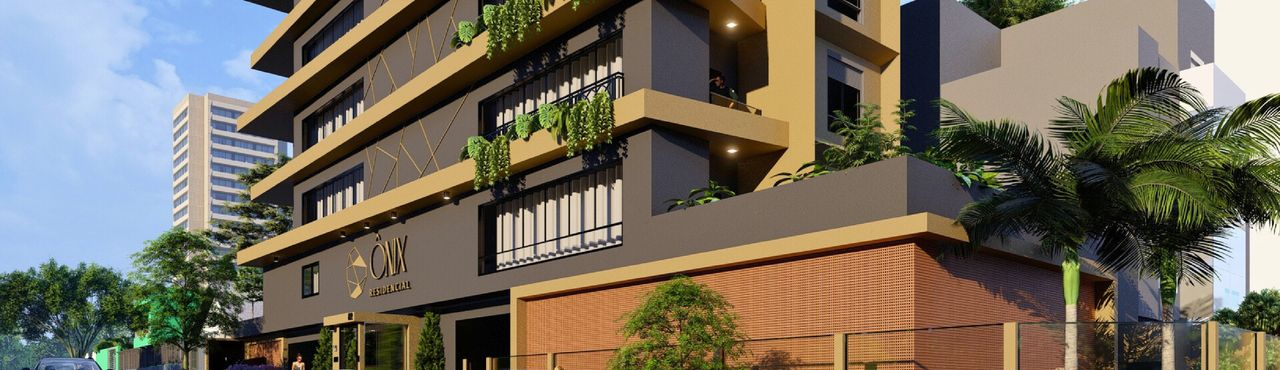 Fachada do Residencial Ônix com sacadas, jardins suspensos e muro em tijolo vazado